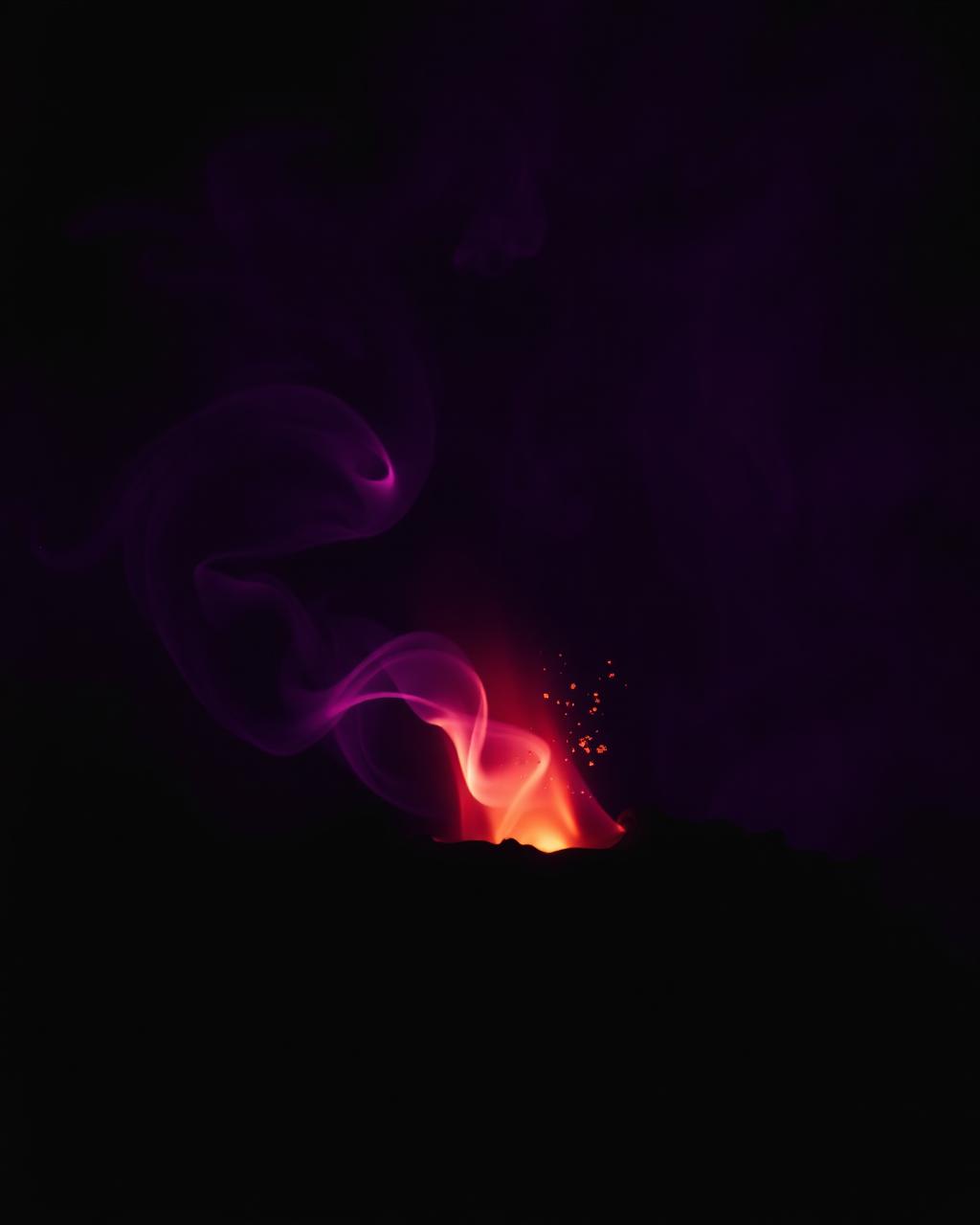 Molten brass and violet light drifting through darkness